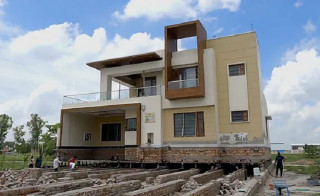 Indian farmer moves two-storey house - an inch at a time